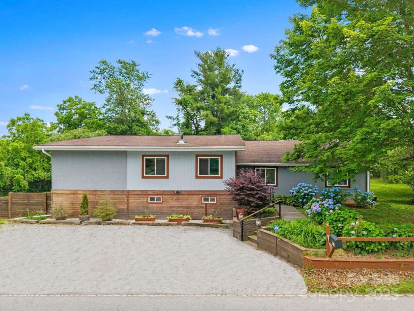 419 Blue Ridge Road, East Flat Rock, NC 28726.  MLS# CAR4269146, YatesRealty ID 18842. The driveway has been digitally enhanced.