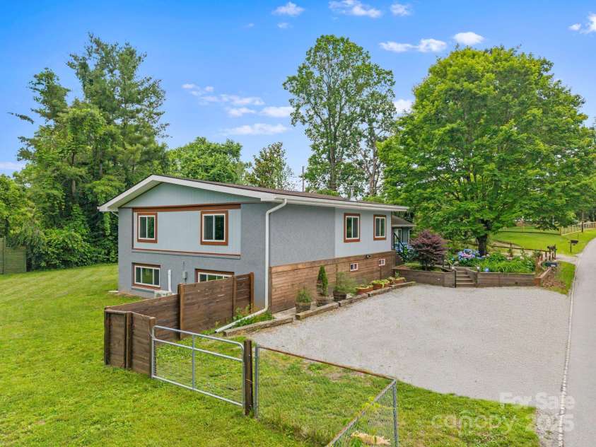 419 Blue Ridge Road, East Flat Rock, NC 28726.  MLS# CAR4269146, YatesRealty ID 18842. The driveway has been digitally enhanced.