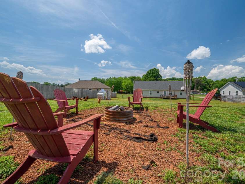 2486 Rock Dam Road, Lincolnton, NC 28092.  MLS# CAR4335118, YatesRealty ID 18846. Firepit in back yard