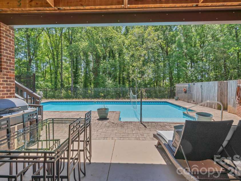 105 Winchester Drive, Shelby, NC 28152.  MLS# CAR4375983, YatesRealty ID 18850. Covered patio from basement to pool