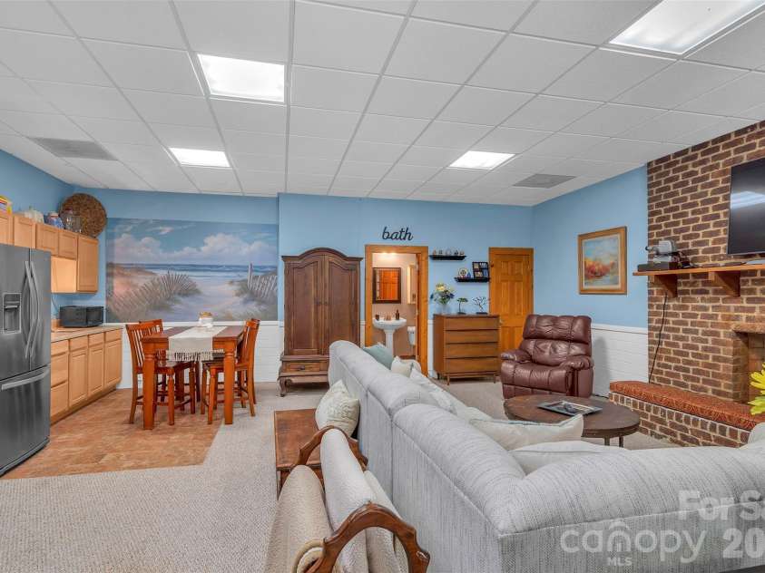 105 Winchester Drive, Shelby, NC 28152.  MLS# CAR4375983, YatesRealty ID 18850. Finished basement with gas log fireplace & kitchenette