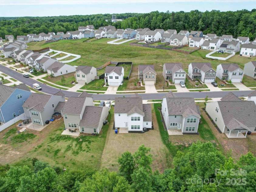 5121 Arbordale Way, Mount Holly, NC 28120.  MLS# CAR4269641, YatesRealty ID 18852. Drone view of the Community