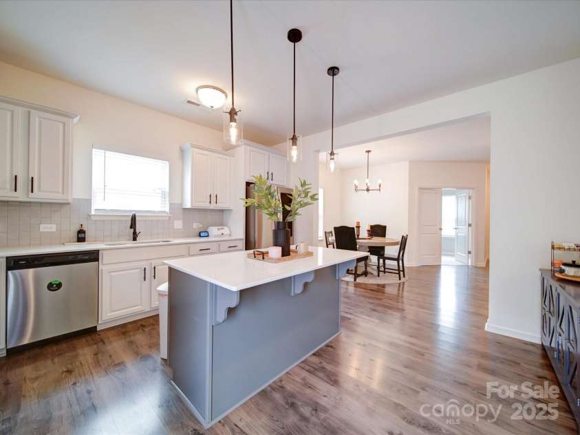 5121 Arbordale Way, Mount Holly, NC 28120.  MLS# CAR4269641, YatesRealty ID 18852. This view of the Kitchen shows an Open View into the Dining Area