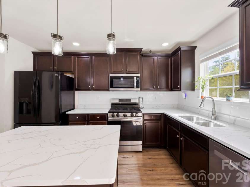 4715 Mcclure Road, Charlotte, NC 28216.  MLS# CAR4403073, YatesRealty ID 18855. Current cabinet color and refrigerator