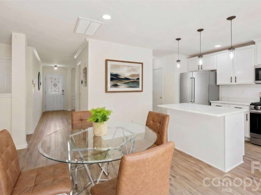 4715 Mcclure Road, Charlotte, NC 28216.  MLS# CAR4403073, YatesRealty ID 18855. Visualization of white cabinet & refrigerator upgrade