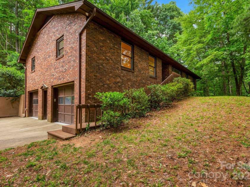 137 Flynn Branch Road, Asheville, NC 28804.  MLS# CAR4258132, YatesRealty ID 18863. Front corner and side elevation