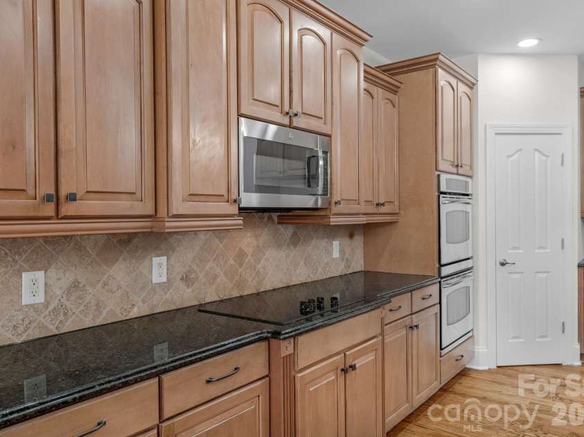 1300 Longleaf Court, Weddington, NC 28104.  MLS# CAR4306141, YatesRealty ID 18872. Behind that door...