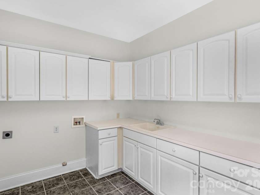 1300 Longleaf Court, Weddington, NC 28104.  MLS# CAR4306141, YatesRealty ID 18872. Laundry room
