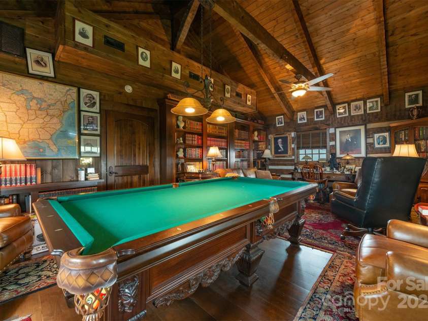 143 Daniel Boone Trail, Burnsville, NC 28714.  MLS# CAR4261449, YatesRealty ID 18872. Amazing built-in wood shelves are perfect for the avid reader