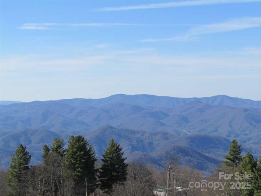 143 Daniel Boone Trail, Burnsville, NC 28714.  MLS# CAR4261449, YatesRealty ID 18872. One never tires of a view like this