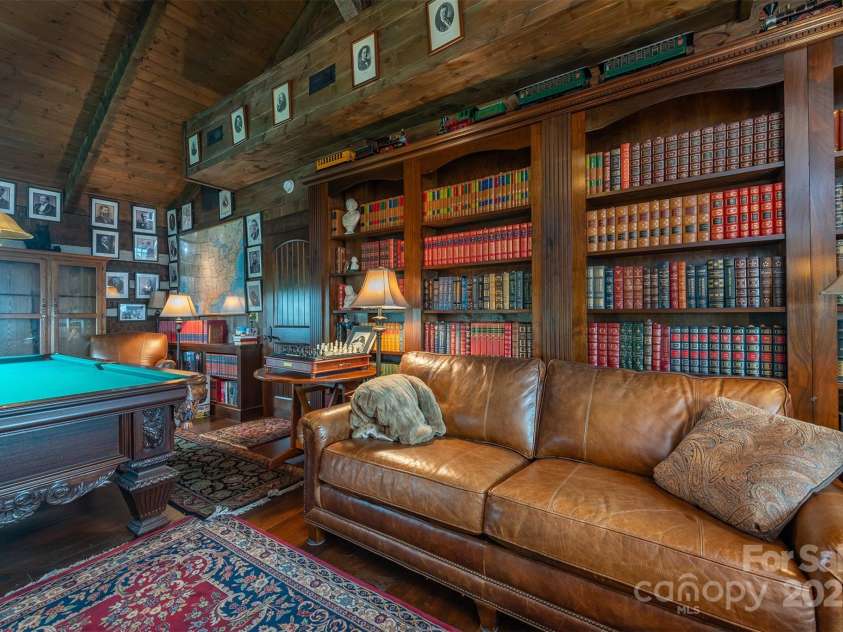 143 Daniel Boone Trail, Burnsville, NC 28714.  MLS# CAR4261449, YatesRealty ID 18872. Third bedroom currently used as a billiard room and a library