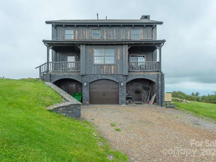 143 Daniel Boone Trail, Burnsville, NC 28714.  MLS# CAR4261449, YatesRealty ID 18872. Unique one-owner home