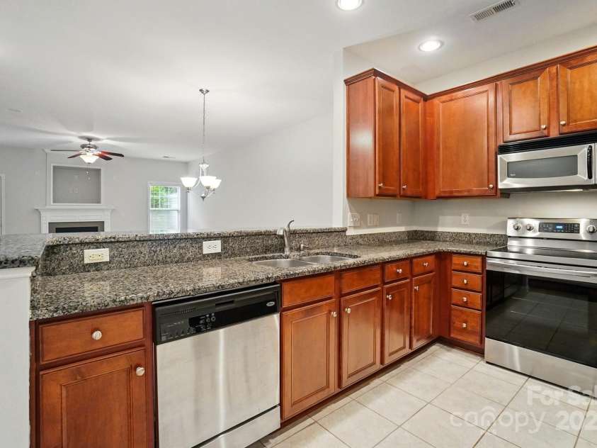 310 Rose Garden Court, Rock Hill, SC 29732.  MLS# CAR4202341, YatesRealty ID 18877. Freshly painted interior! And keep scrolling to see brand new carpet also! Kitchen with granite counters overlooks dining and family room.