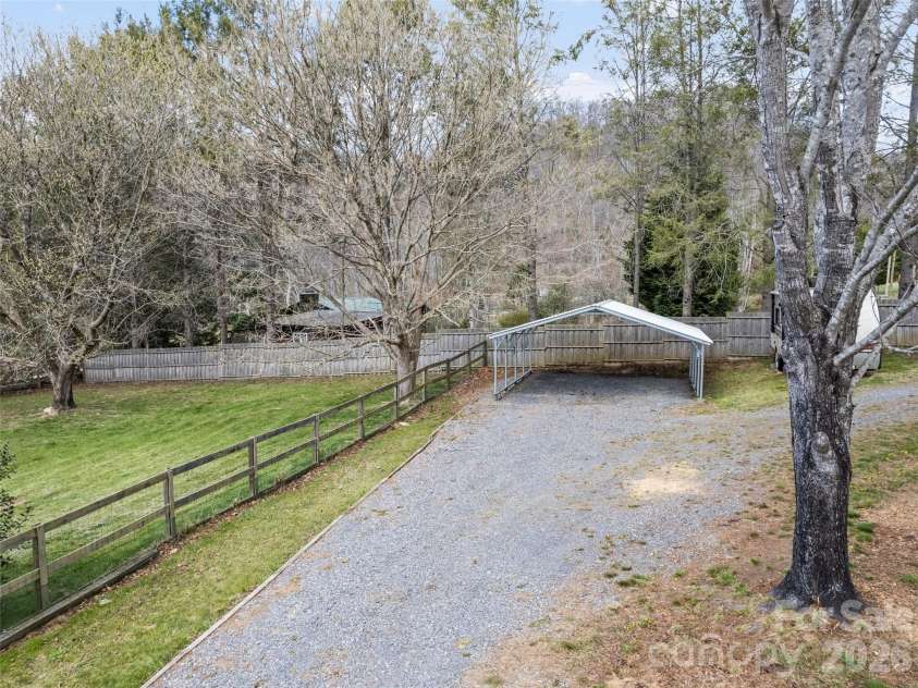 838 Hidden Valley Road, Clyde, NC 28721.  MLS# CAR4364695, YatesRealty ID 18881. Ample parking in driveway and under carport