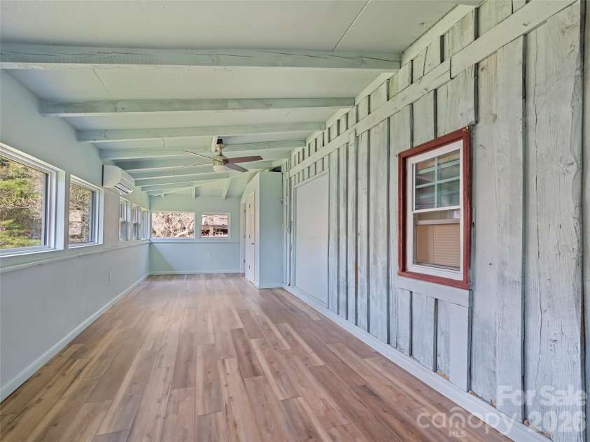 838 Hidden Valley Road, Clyde, NC 28721.  MLS# CAR4364695, YatesRealty ID 18881. Primary Suite addition  is bright and airy