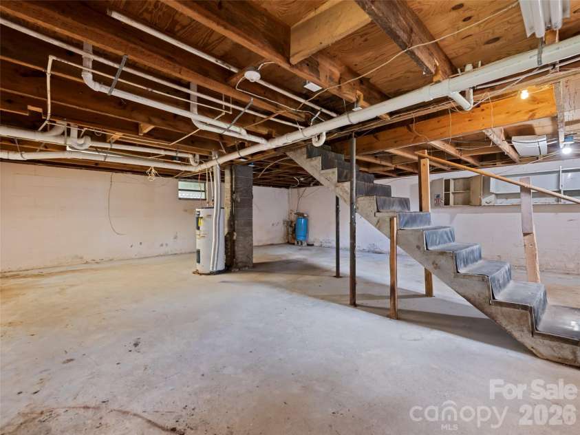 838 Hidden Valley Road, Clyde, NC 28721.  MLS# CAR4364695, YatesRealty ID 18881. Unfinished Basement