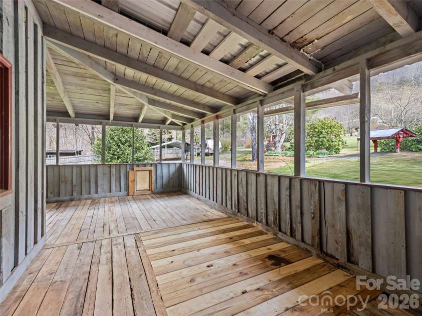 838 Hidden Valley Road, Clyde, NC 28721.  MLS# CAR4364695, YatesRealty ID 18881. Wraparound deck