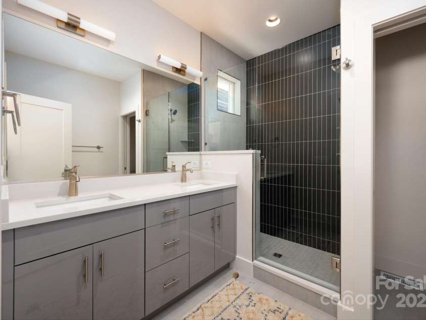 9 Orrinel Way, Asheville, NC 28806.  MLS# CAR4257922, YatesRealty ID 18885. Ensuite Full Bath with Quartz-Topped Double Vanity and Tiled, Walk-In Shower