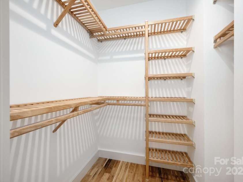 9 Orrinel Way, Asheville, NC 28806.  MLS# CAR4257922, YatesRealty ID 18885. Walk-In Closet with Custom Wood Organization