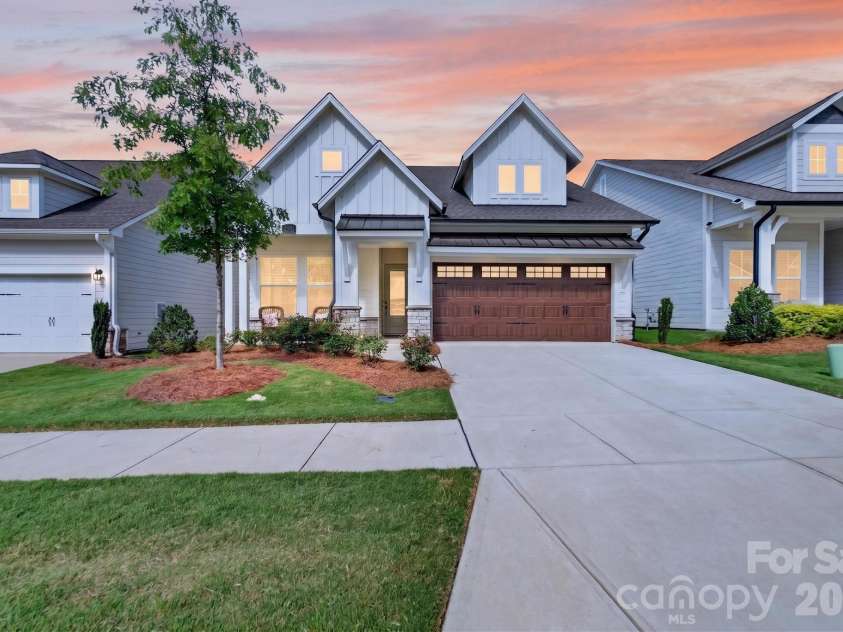 1338 Encore Lane, Waxhaw, NC 28173.  MLS# CAR4395212, YatesRealty ID 18890. Evening Front Exterior