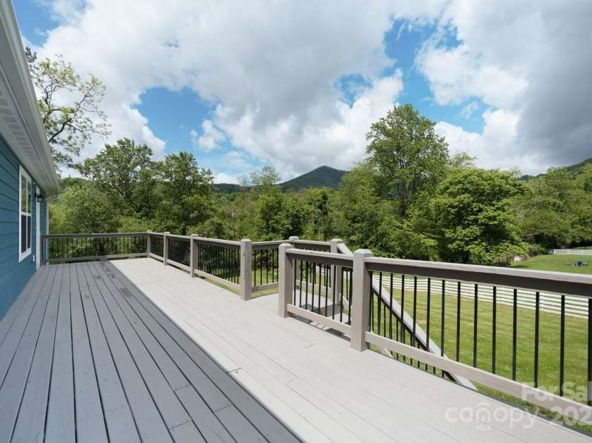 123 Dapple Road, Candler, NC 28715.  MLS# CAR4257282, YatesRealty ID 18892. Enjoy mountain views from the large deck
