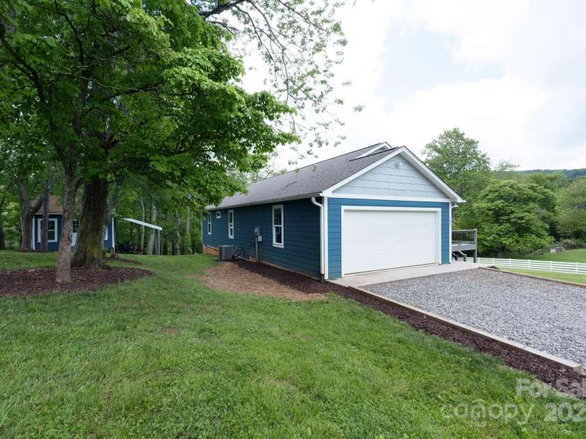123 Dapple Road, Candler, NC 28715.  MLS# CAR4257282, YatesRealty ID 18892. Side yard to detached studio