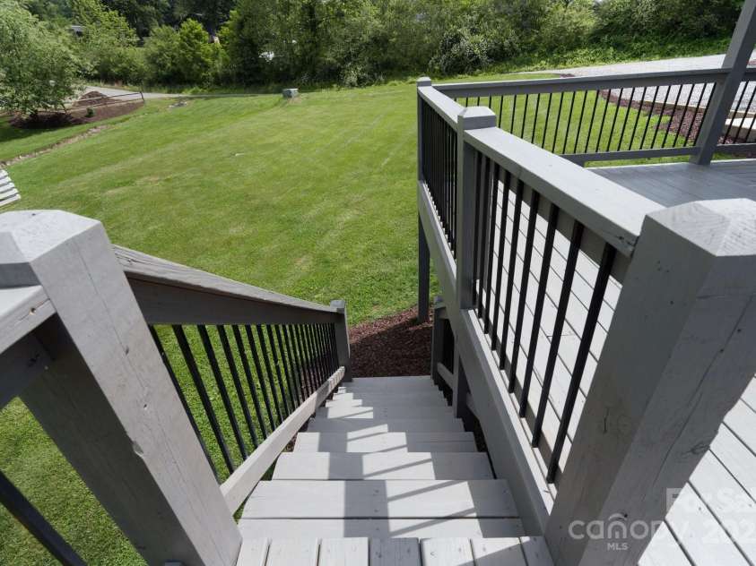 123 Dapple Road, Candler, NC 28715.  MLS# CAR4257282, YatesRealty ID 18892. Stairs down to lower level and yard