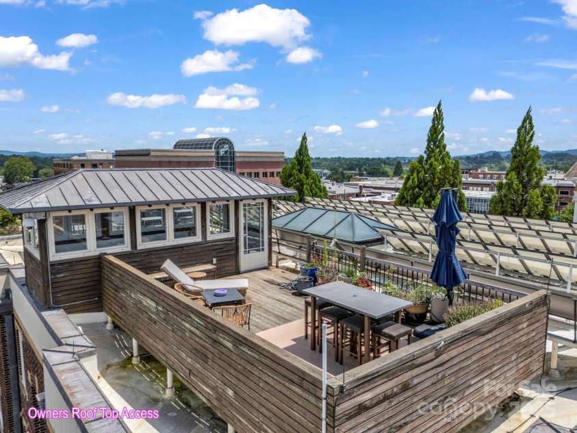 203 6th Avenue, Hendersonville, NC 28739.  MLS# CAR4288242, YatesRealty ID 18894. Exclusive Rooftop escape for condo owners to enjoy