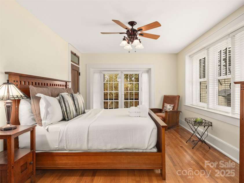 203 6th Avenue, Hendersonville, NC 28739.  MLS# CAR4288242, YatesRealty ID 18894. Primary bedroom suite. The attention to detail and architecture in this is what truly warms the space and the peace and quiet and money put into the noise reduction, yet being so close!