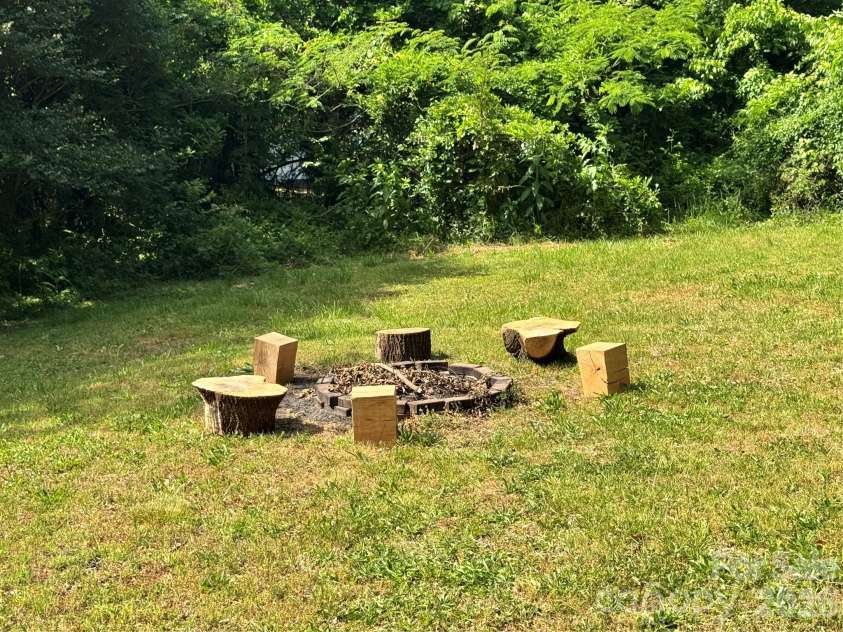 153 American Avenue, Concord, NC 28025.  MLS# CAR4373583, YatesRealty ID 18898. Firepit