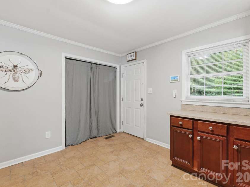 153 American Avenue, Concord, NC 28025.  MLS# CAR4373583, YatesRealty ID 18898. Kitchen / Laundry