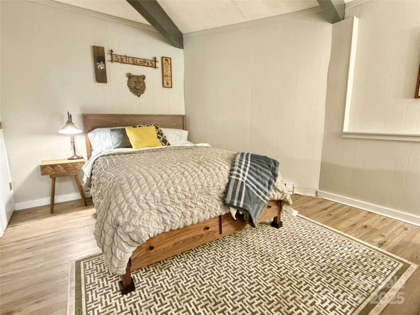 109 Beechwood Lane, Beech Mountain, NC 28604.  MLS# CAR4259701, YatesRealty ID 18902. Lower Unit - Room queen bed