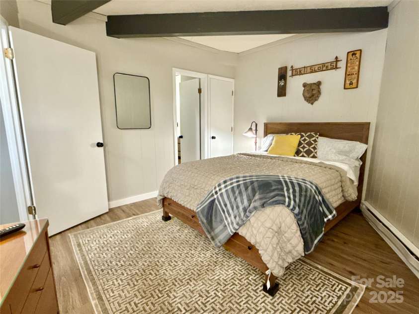 109 Beechwood Lane, Beech Mountain, NC 28604.  MLS# CAR4259701, YatesRealty ID 18902. Lower Unit - Room queen bed