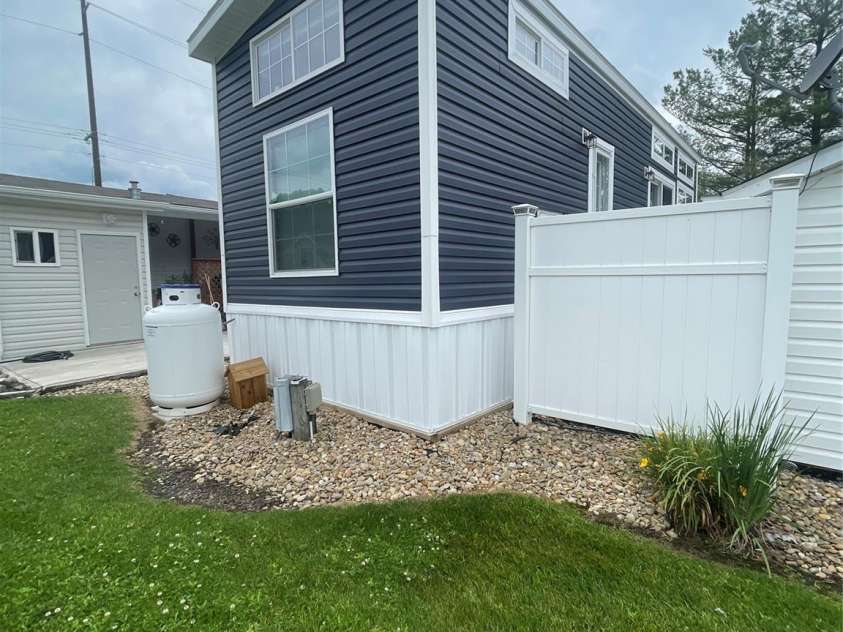 43 Vacation Pointe, Waynesville, NC 28785.  MLS# CAR4267523, YatesRealty ID 18903. Back of park model and lot.