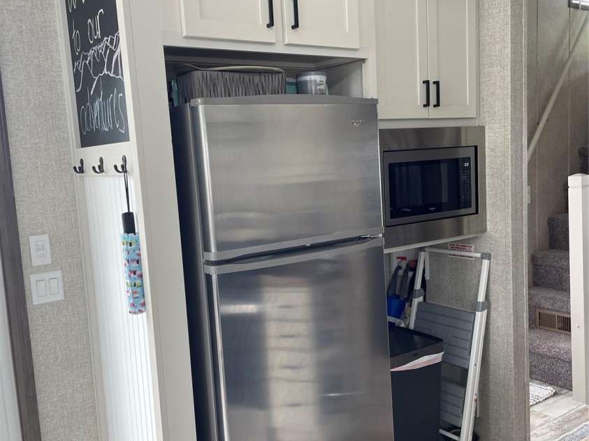 43 Vacation Pointe, Waynesville, NC 28785.  MLS# CAR4267523, YatesRealty ID 18903. Refrigerator, microwave and storage area.
