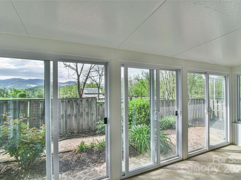 33 Honeycomb Circle, Swannanoa, NC 28778.  MLS# CAR4250614, YatesRealty ID 18915. GLASSED IN 3 SEASON SUN ROOM