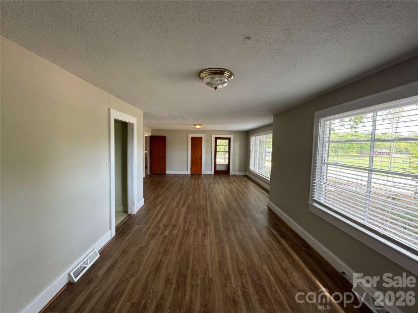 509 Main Street, Locust, NC 28097.  MLS# CAR4365906, YatesRealty ID 18915. Dining and Living 
