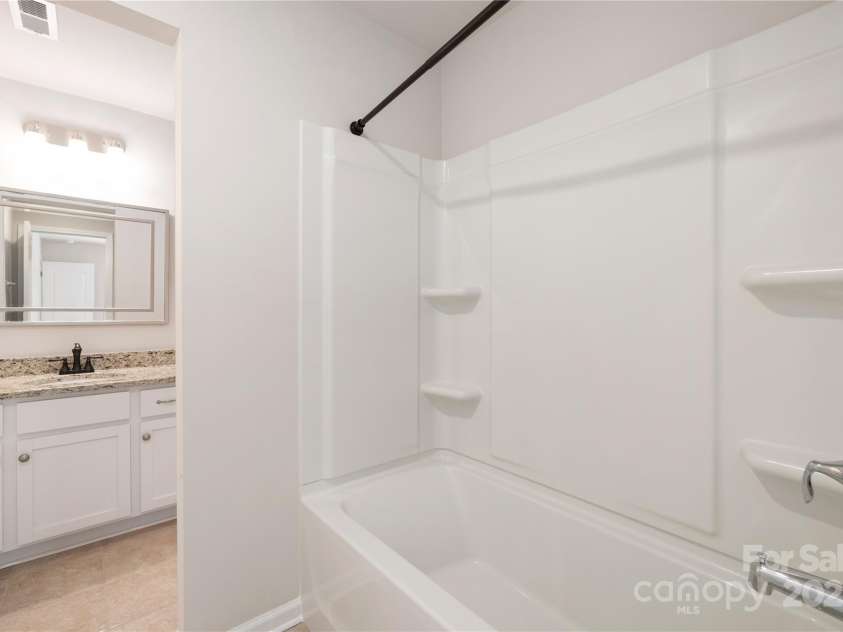14210 Asbury Park Road, Huntersville, NC 28078.  MLS# CAR4252719, YatesRealty ID 18916. Full upstairs bathroom