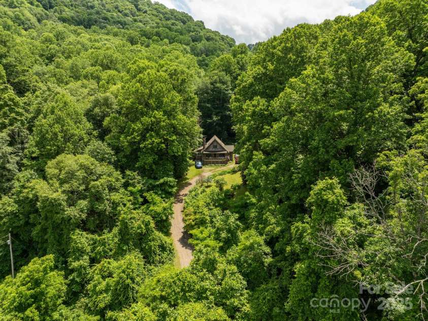 687 Willow Creek Road, Leicester, NC 28748.  MLS# CAR4269664, YatesRealty ID 18921. Mountain Cabin on 36 acres.
