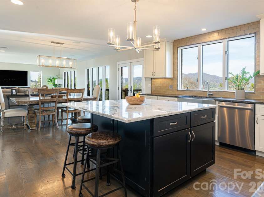 83 Cozy Mountain Lane, Weaverville, NC 28787.  MLS# CAR4368940, YatesRealty ID 18921. Kitchen looking towards den