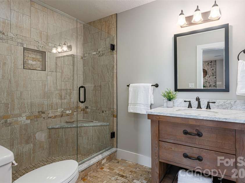 83 Cozy Mountain Lane, Weaverville, NC 28787.  MLS# CAR4368940, YatesRealty ID 18921. Lower level full bathroom