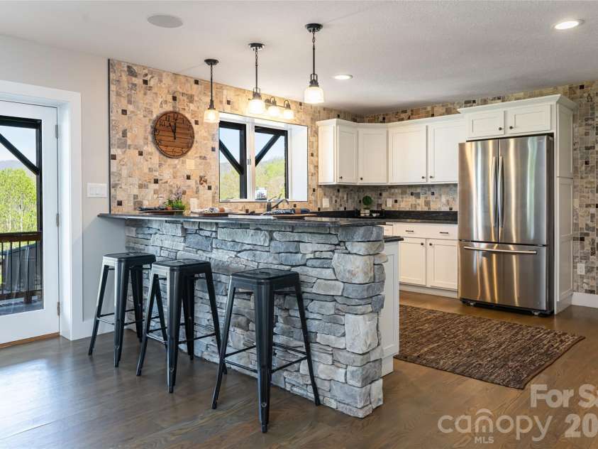 83 Cozy Mountain Lane, Weaverville, NC 28787.  MLS# CAR4368940, YatesRealty ID 18921. Lower level kitchen