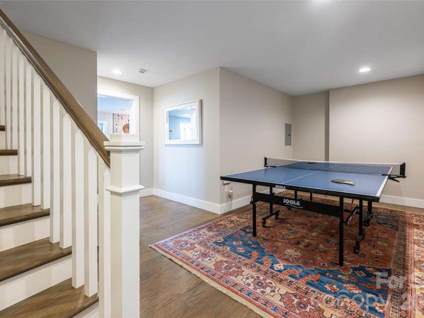 83 Cozy Mountain Lane, Weaverville, NC 28787.  MLS# CAR4368940, YatesRealty ID 18921. Lower level recreation area