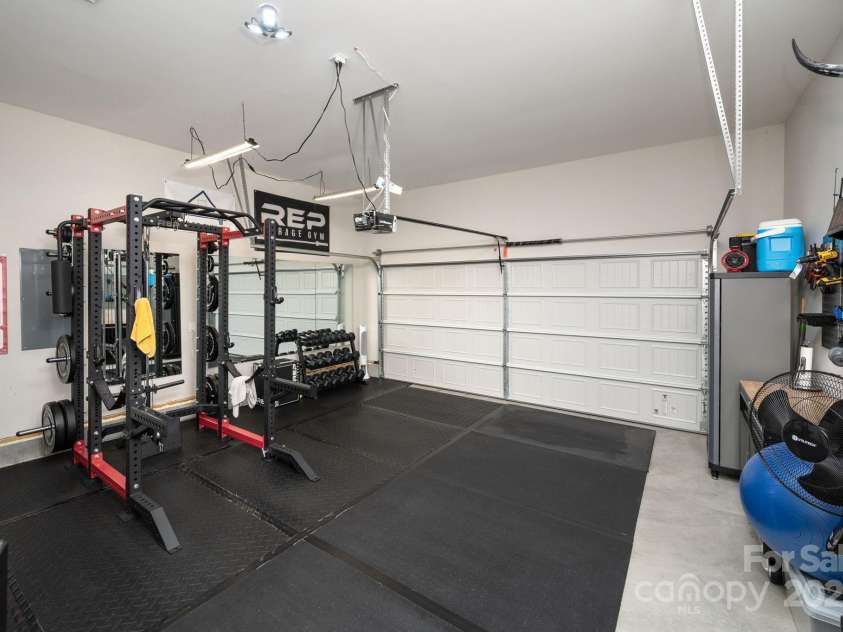 45 Dreambird Drive, Leicester, NC 28748.  MLS# CAR4266636, YatesRealty ID 18923. Two-Car Garage Gym Setup