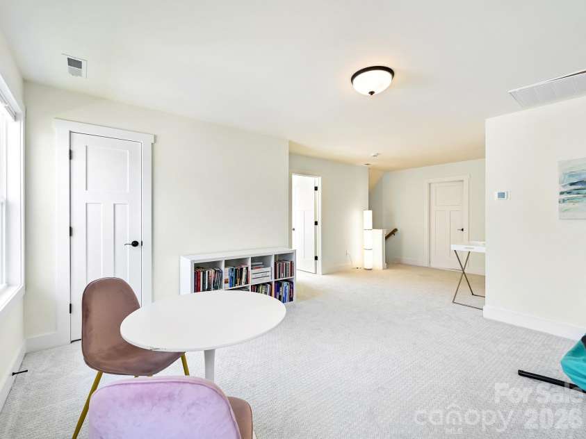 21 Christie Court, Fletcher, NC 28732.  MLS# CAR4371496, YatesRealty ID 18924. Upper level flex space with storage closet. 