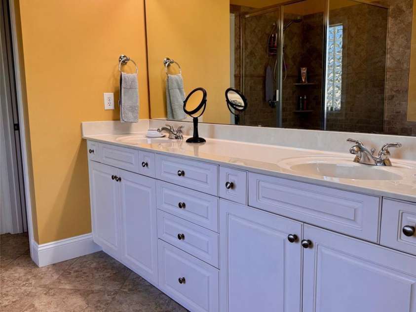 5006 Shannamara Drive, Matthews, NC 28104.  MLS# CAR4338291, YatesRealty ID 18925. Primary bathroom Dual vanities