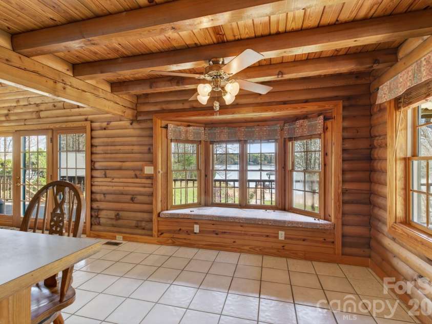 5981 Johnson Road, Clover, SC 29710.  MLS# CAR4358157, YatesRealty ID 18926. Dining room with tile floors, bayed window and window seat lakeview