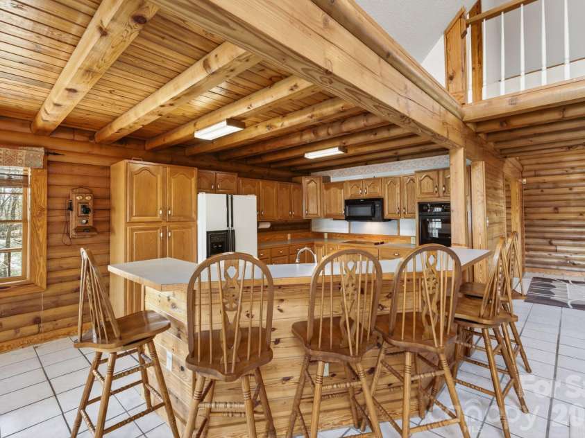 5981 Johnson Road, Clover, SC 29710.  MLS# CAR4358157, YatesRealty ID 18926. Kitchen with raised bar with barstools