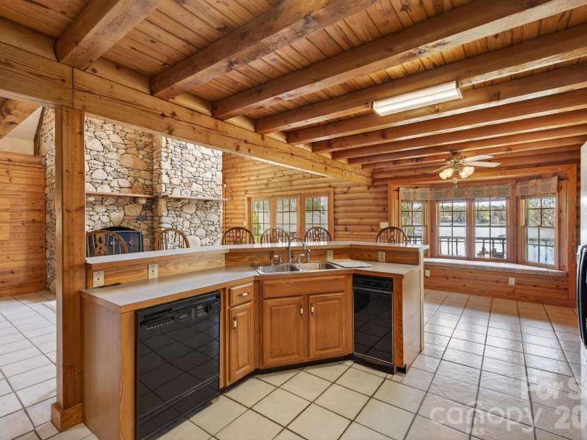 5981 Johnson Road, Clover, SC 29710.  MLS# CAR4358157, YatesRealty ID 18926. Open kitchen showcasing the dining area with a bayed window and the 2-story family room