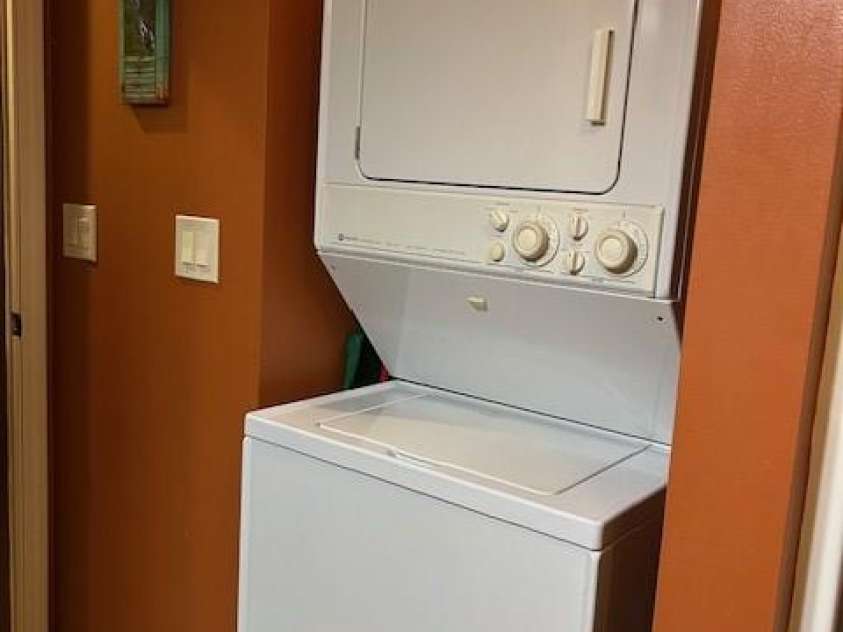 116 Minerva Lane, Sapphire, NC 28774.  MLS# CAR4237813, YatesRealty ID 1893. Stackable washer dryer in bathroom